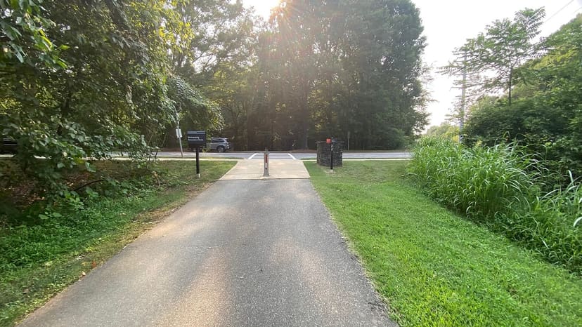 Paved Mallard Creek Greenway approaching the David Taylor Drive crossing in Charlotte