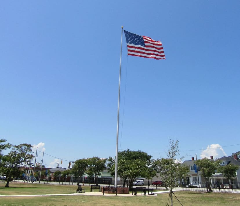 Open lawn and flag station at Katherine Davis Park