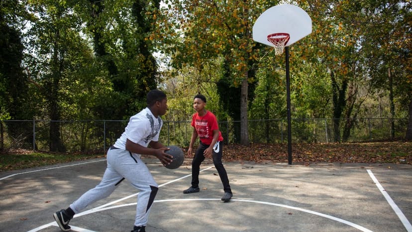 Young people playing basketball at Apollo Heights Park