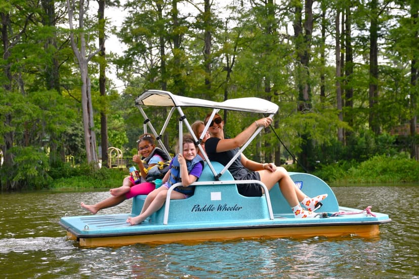 Family using a rental paddle boat on Greenfield Lake