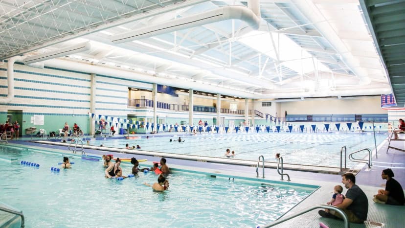 Family using the warm-water pool at Pullen Aquatic Center