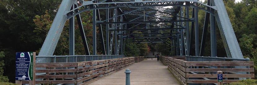 Signed Mile 0 bridge on South Tar River Greenway near Town Common