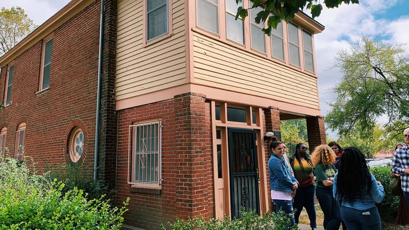Visitors gathered in front of the Pope House Museum
