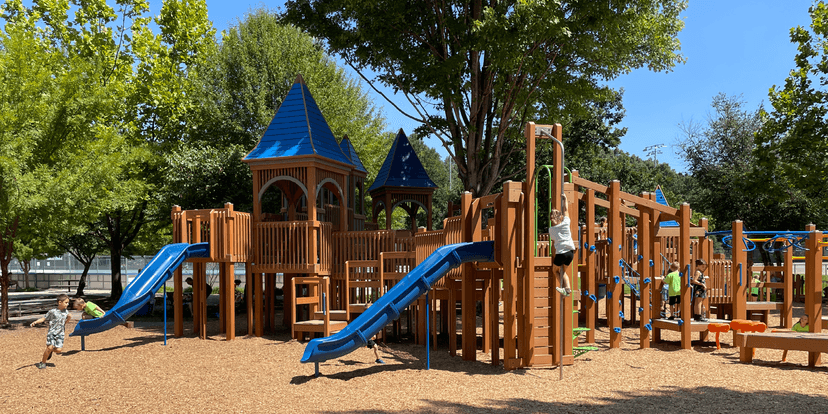 Children exploring the castle-themed playground at Carrier Park